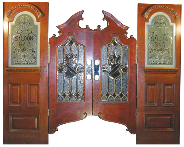 Solid mahogany swinging saloon doors by Brunswick, Balke & Collender Co. ($77,000 a record). Image courtesy Showtime Auction Services.